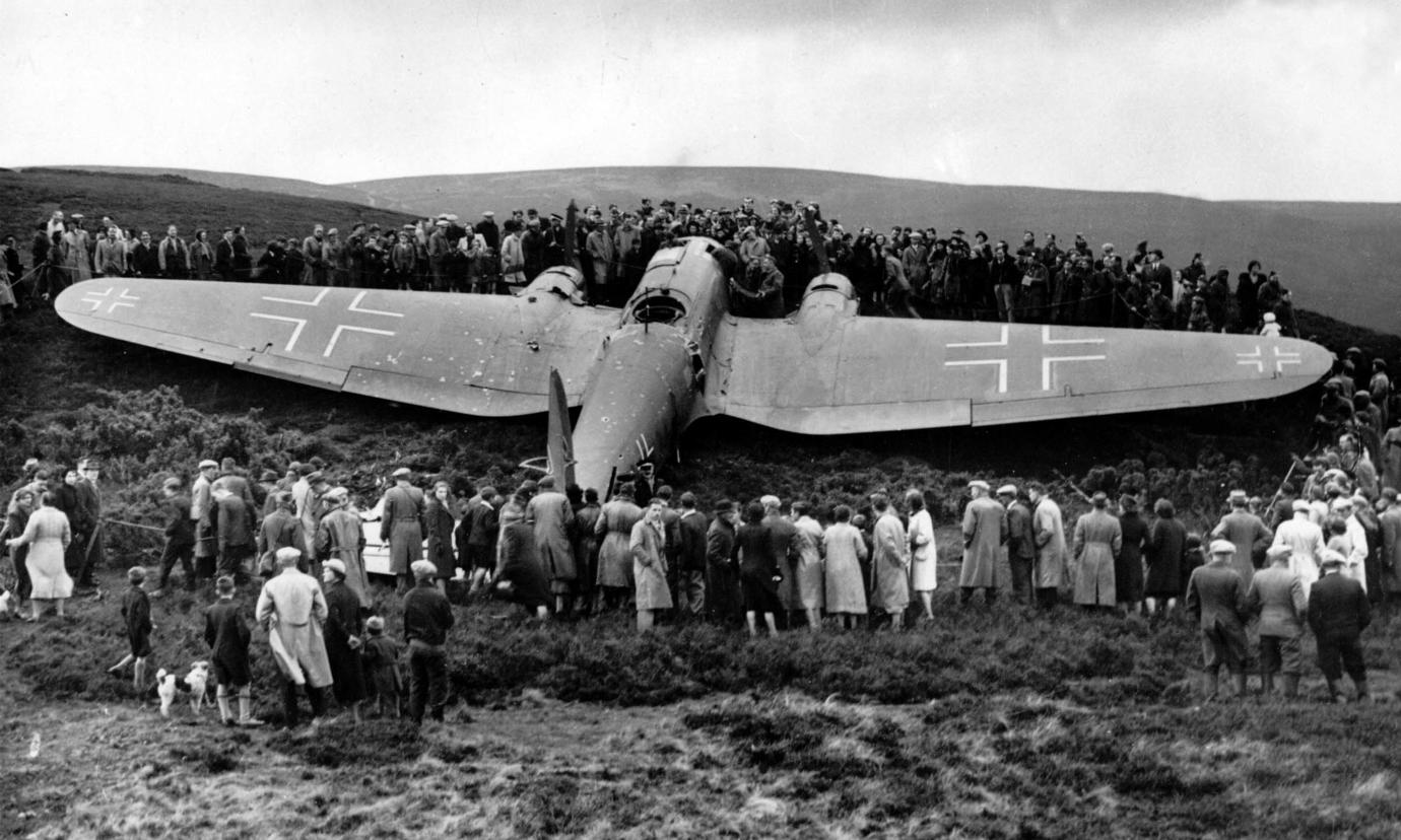 A World War 2 German bomber plane that crashed near Edinburgh during the war. The plane is surround by a crowd of interested locals.