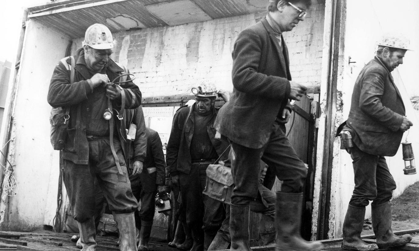 A group of miners leaving the mine after their shift.